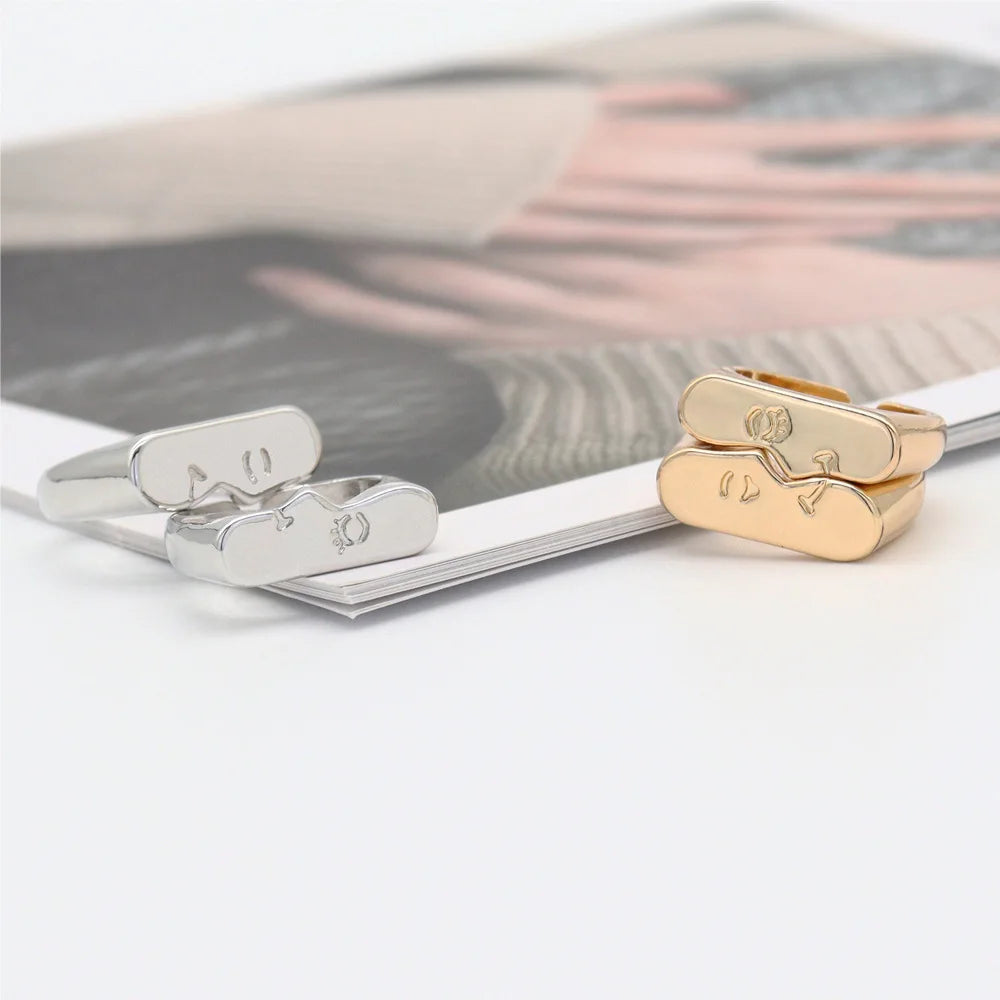 Abstract Face Pair Ring Set