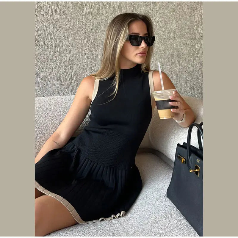 Trendy Black Ribbed Knit Mini Dress - Sleeveless with Pleated Hem