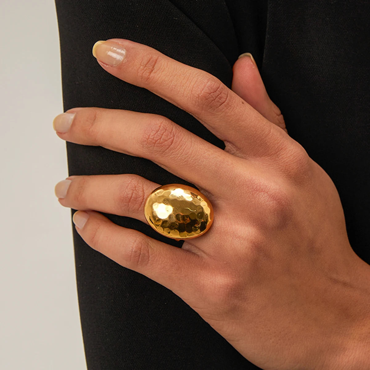 Modern Elegance: Chunky Gold Oval Ring with Hammered Finish