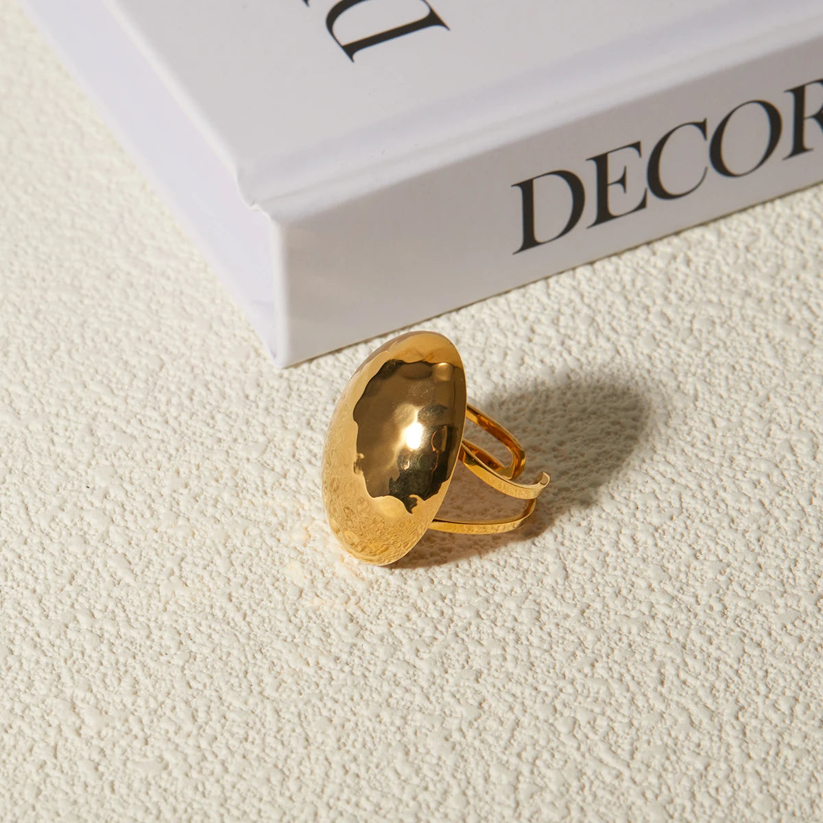 Modern Elegance: Chunky Gold Oval Ring with Hammered Finish