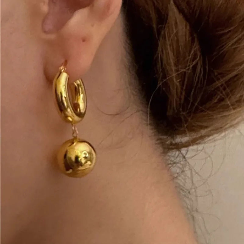 Statement Western Elegance: Chunky Gold Hoop Earrings with Ball Drop