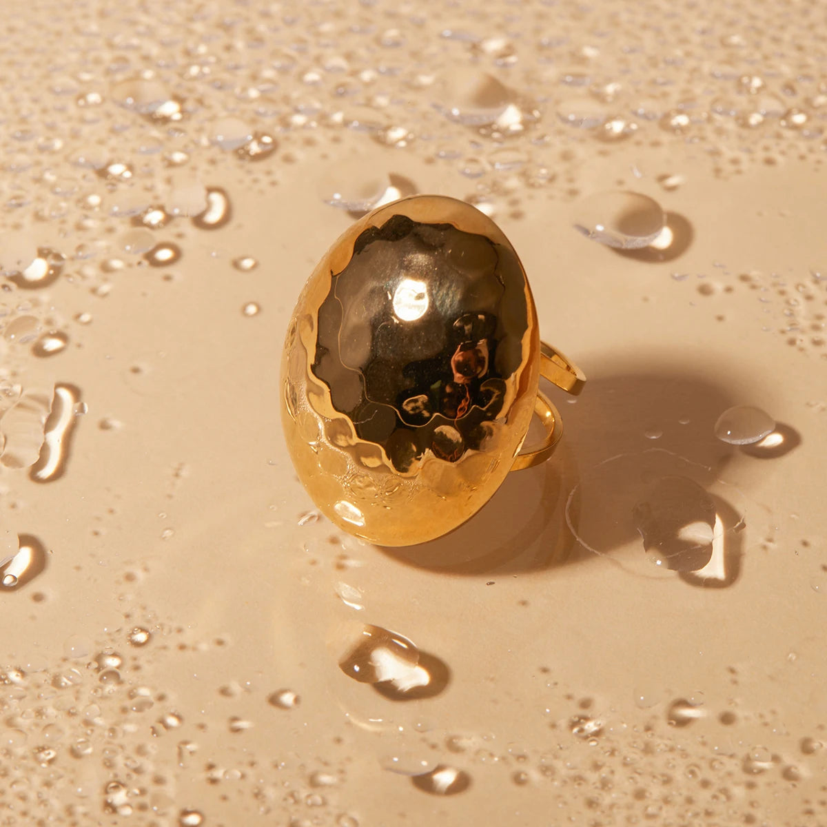 Modern Elegance: Chunky Gold Oval Ring with Hammered Finish